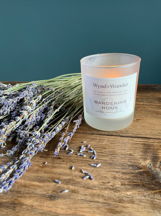 Aromatherapy candle - lit candle with dried lavender bunch - lavender oil - patchouli oil - orange oil - self reflection